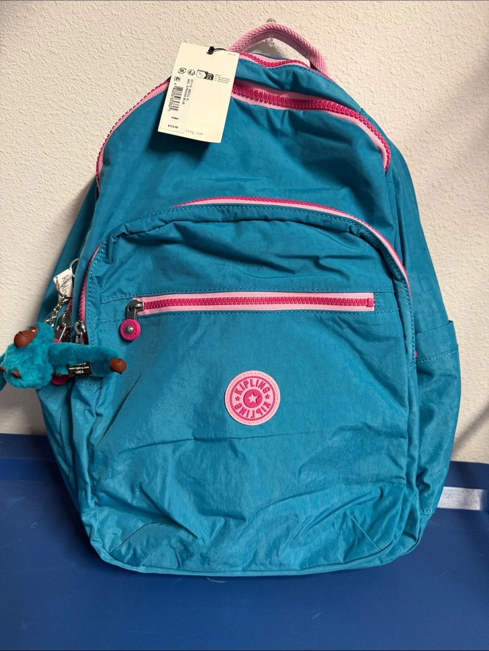 Kipling Turquoise Backpack with Pink Accents